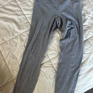 Three pairs Lululemon yoga pants, gray, olive green and bright blue.